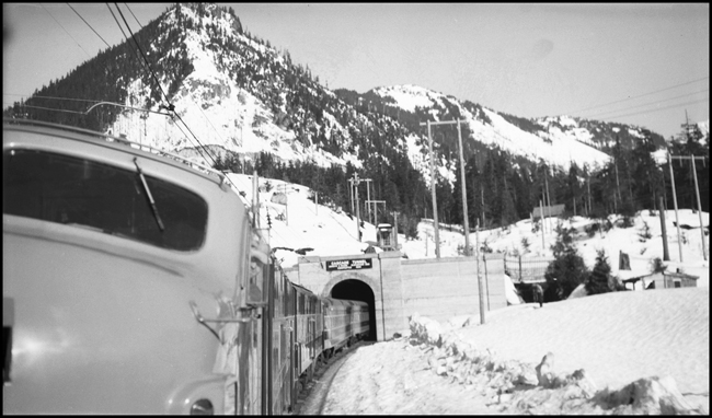 GN Ex EB leaving Cascade Tunnel near Scenic, WA 2-17-47.  Picture taken by Nixon from the rear cab of electric helper engine 5012