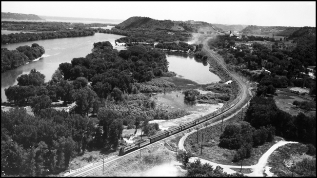CMSP&P passenger train along Mississippi River near Red Wing, MN. 
