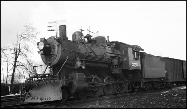 The class S-10 328 was part of a group of locomotives built for another railroad, and purchased by NP when that railroad defaulted on the order.  The 328 was saved after dieselization, and for many years pulled excursion trains in northern Minnesota.  In 2006 it may be found in the Jackson Street Roundhouse in Minneapolis awaiting rebuilding.  It has just pulled a mixed train to the end of the Taylors Falls branch line and back.