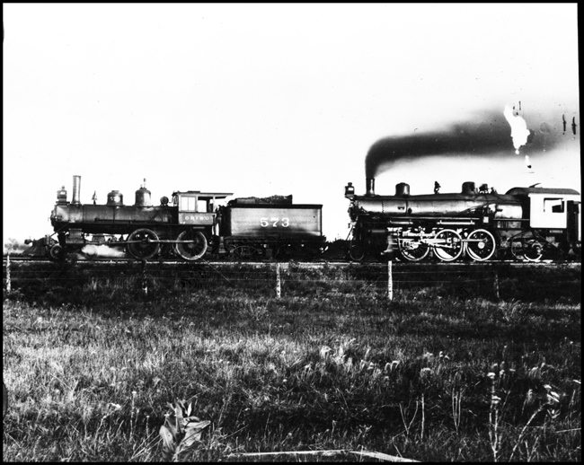 Chicago, Rock Island and Pacific locomotive double heading with an unidentifiable locomotive that appears to be a 2-6-2.  Copy negative from Robert Graham