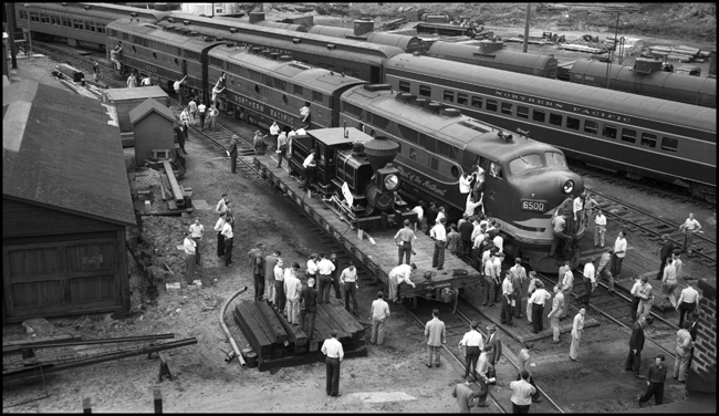 The Minnetonka is one of NP's few named locomotives,  and is en route to the Chicago Railroad Fair.  It is one of four locomotives used in the construction of the NP in the 19th century, spending most of its time on the west end of the line.  It is generally regarded to be NP's first locomotive, and has been preserved and cosmetically restored.  The cataloger thinks it is at the Lake Superior Transportation Museum in Duluth, MN.    NP took delivery of its first passenger F3, 6500, from EMD in January of 1947.  It is the latest word in NP power, shown here in juxtaposition with the first word of NP power.  Also in the picture are student/passengers from passenger extra 1859 east, ERTI special.  The meaning of ERTI is unknown, but Eastern Railroad Telegraph Institute may be conjectured.  The passengers on this train were Nixon's students.  He may have been teaching them telegraphy, but it may also have been more general railroad technology.  The students appear to be having a superb experience in these pre-OSHA days!></td></tr></TABLE>

<TABLE width='100%' cellpadding='15' cellspacing='2'>
<TR><TD ALIGN='left' BGCOLOR='#FFFFFF'><FONT face=Tahoma', Geneva, sans-serif; size=3 color='#000000'><B>Caption:</B>&nbsp;