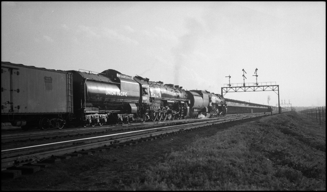 Going away shot of UP Extra 9050 West, with doubleheaded 4-12-2s, leaving Council Bluffs, IA, yard.