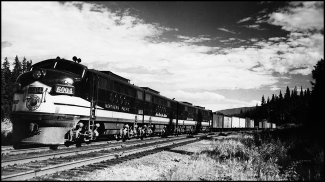 NP X6004W with NP 6004 an FT locomotive, waiting to meet a train around Easton, WA.