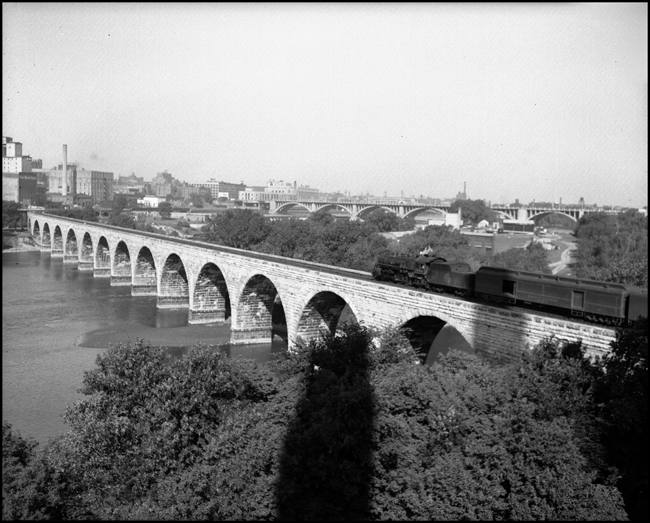 Westbound CGW passenger train on Stone Arch Bridge, Minneapolis.