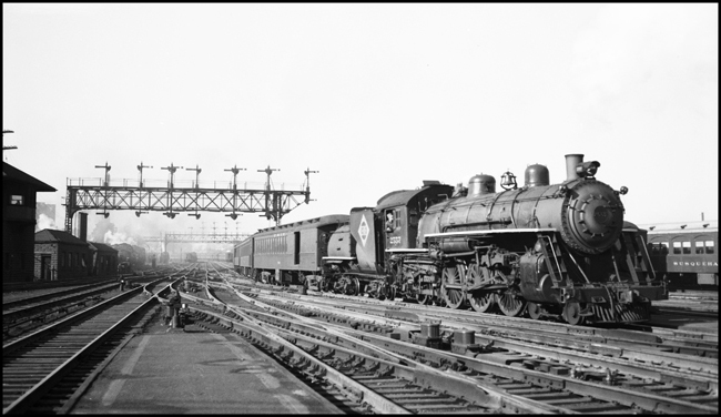Erie- 4-6-2 2557 and signal bridge, Jersey City.