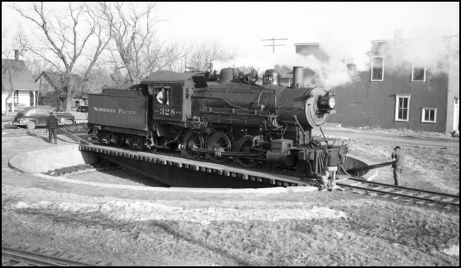NP 328, Class S-10, on Strong arm turntable at Grantsburg, WI, while locomotive is being turned.