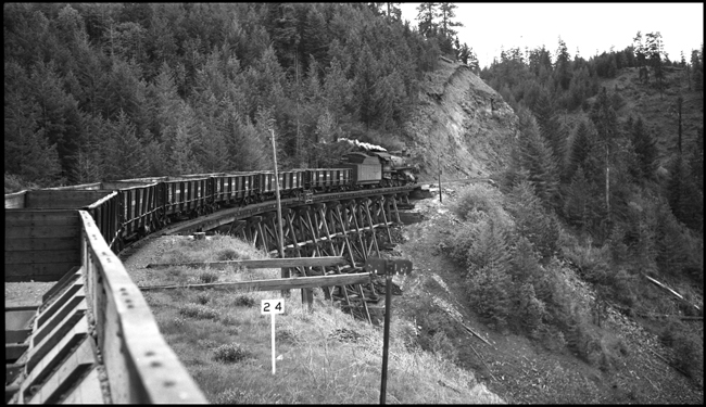 2-8-2 Mikado,  Class W,  NP 1521 with a freight train and also pulling NP 684 to Spokane where the old locomotive will be restored by the NP.  The train is between Reubens and Nucrag, Idaho.