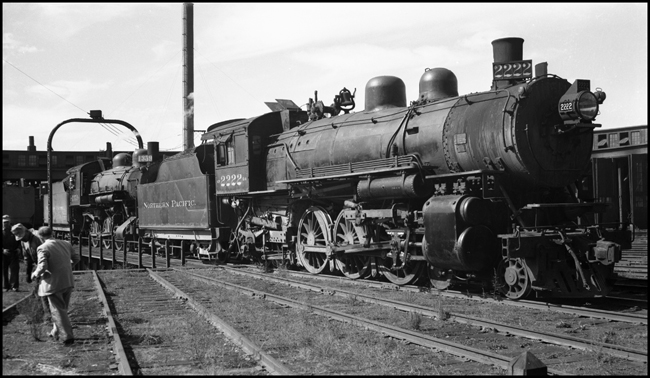 NP 2222, a 4-6-2 Pacific Class Q-4 has drawn a crowd to the Spokane roundhouse.  NP 1359 sits behind her.