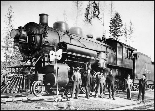 Milwaukee Road 5523 with crew at Ione, Washington.