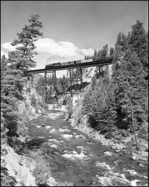 NP 1719, a 2-8-2 Mikado Class W-3 heads an east bound freight train on the Rivulet Trestle near Rivulet, Montana.