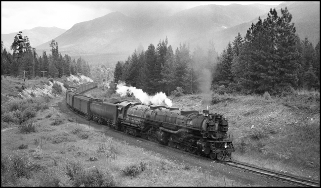 NP 5112, a 4-6-6-4 Challenger Class Z-6, with an east bound train of passenger refrigerator cars near Schley, Montana.