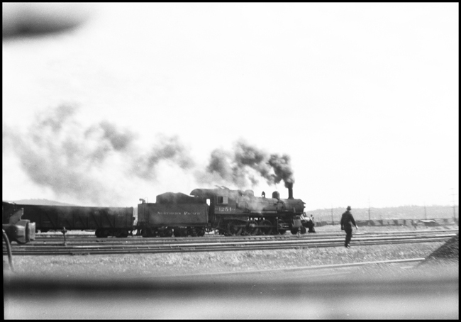 NP 1254, a 2-8-0 Consolidation Class Y-2, with a freight train at Yarldey, Washington.