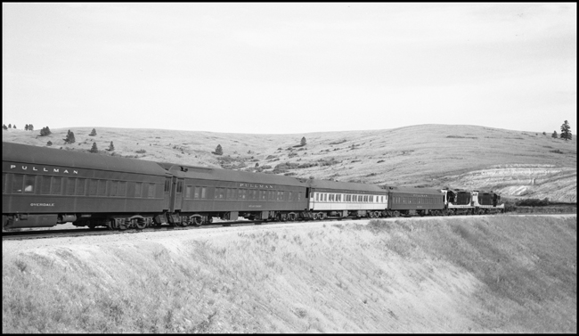 Helper diesel locomotives at rear of 2nd No. 1, being pulled west by NP 2689 near Lagos, MT