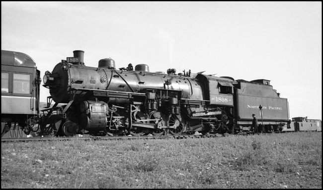 NP 1808, Class W-3 locomotive on the rear of a passenger train at Livingston, MT.