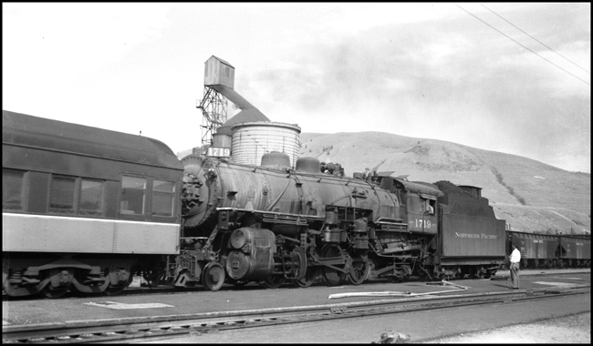 NP 1719, Class W-3 hooked on the  rear car of NP Train No. 1, ready to provide help over the hill.  