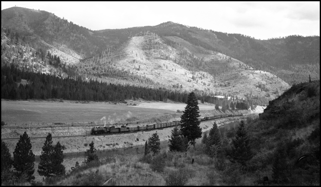 NP Train X1814E, near Lothrop, with locomotive NP 1814, Class W-3, and a freight train which included NP 1356, Class S-4, locomotive.  NP 1356 was being moved to Missoula, from So Tacoma Shop, for permanent display.  