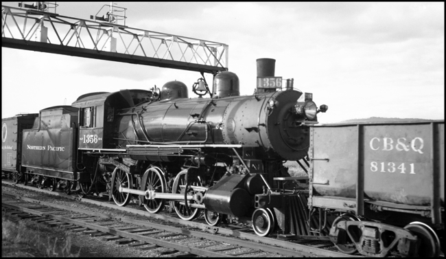 NP 1356, Class S-4 locomotive, moving in train X1814E, photographed crossing in DeSmet. NP 1356 is on the way to permanent display location in Missoula. 