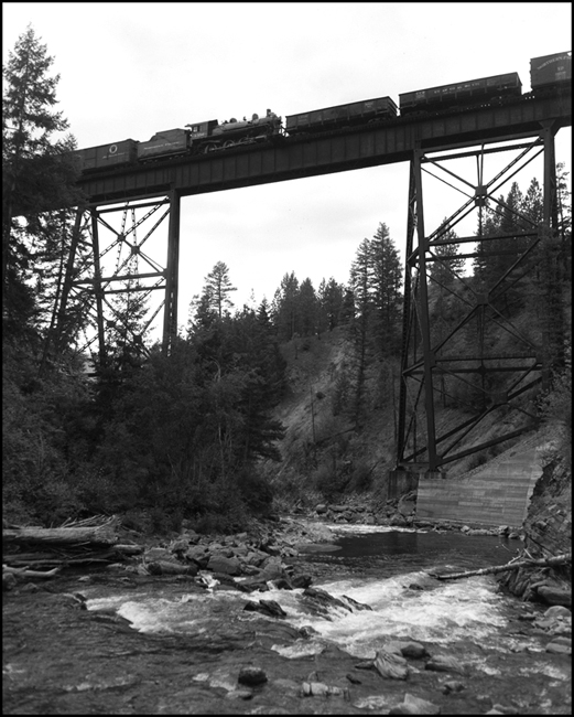 NP 1356, Class S-4 locomotive, moving in train X1814E, photographed crossing bridge at Fish Creek.  NP 1356 is on the way to permanent display location in Missoula. 