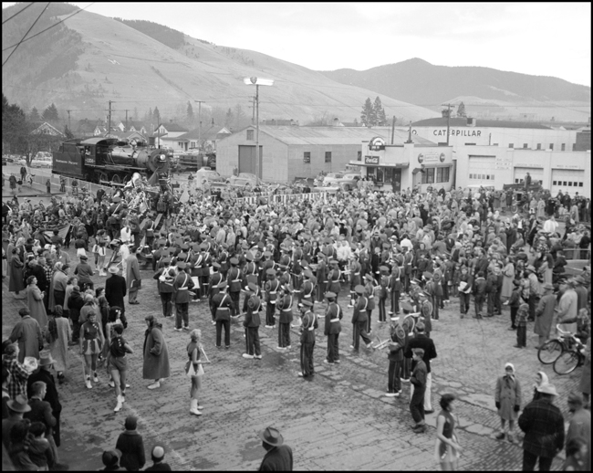 Crowd watching band marching to dedication of NP 1356 display in Missoula, MT