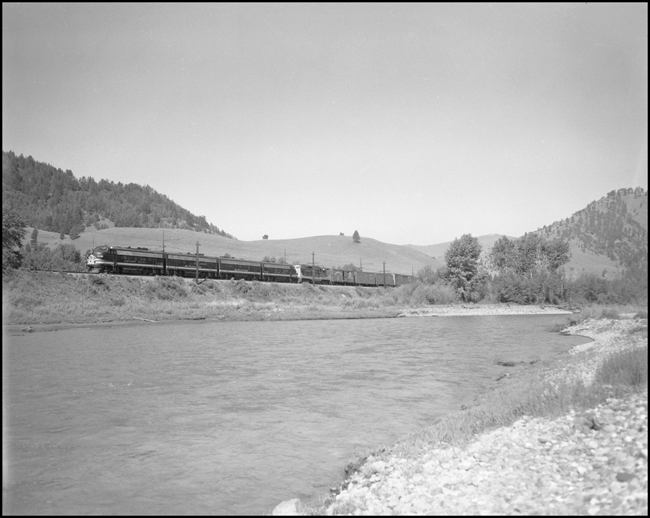NP 7014, EMD F-9A and an EMD GP eastbound along the Clark Fork River near Bearmouth, MT