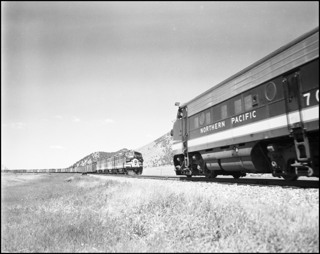 NP 7000, EMD F-9A, east bound extra freight meets NP 7011 F-9A extra freight near Placer, MT