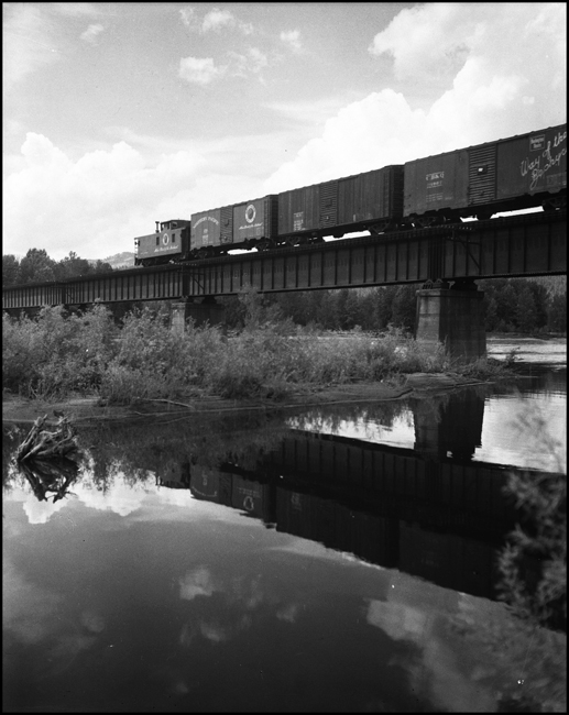 Rear of an extra east bound freight train crossing the Clark Fork River at Huson, MT.