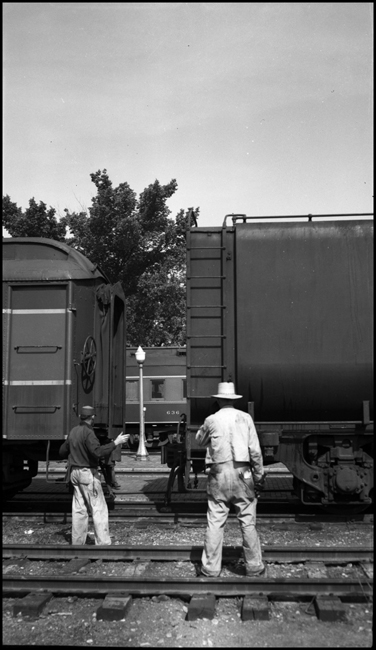 NP 2681 tender being coupled to train No. 4 at Glendive, MT.