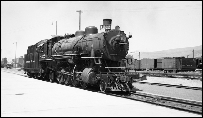 NP 1522. 2-8-2 Class W Mikado leaving the yard at Missoula, MT.