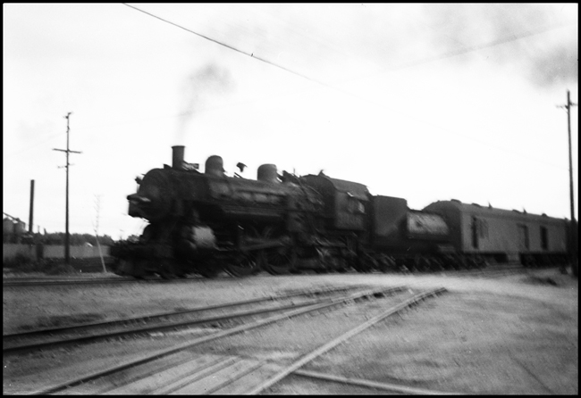 SP 3036, 4-4-2 steam locomotive, with a baggage-mail car attached so this is probably in a passenger train at Marysville, CA.