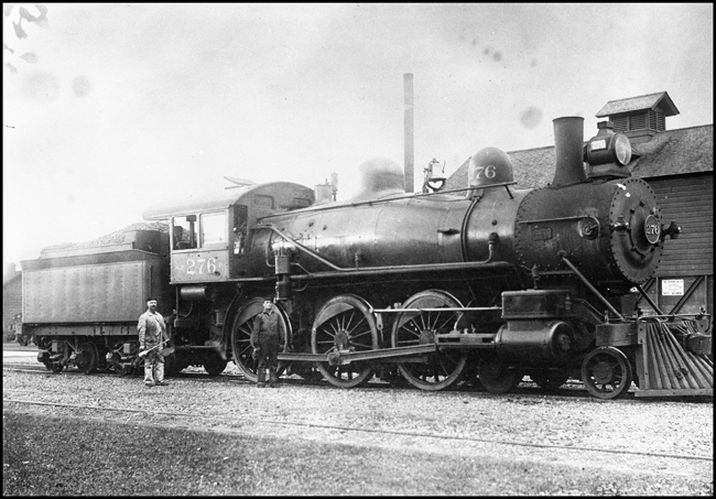 NP 276, Class P locomotive with Engineer holding oil can