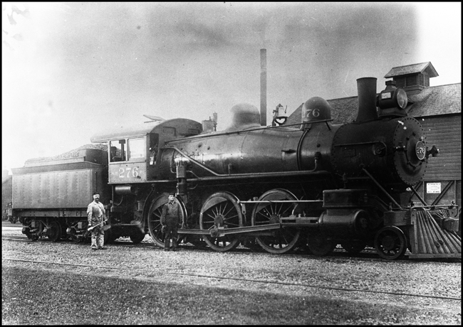 NP 276, Class P locomotive with Engineer holding oil can