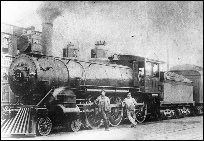 NP 351, Class E-3 locomotive at Spokane, with crew leaning against side rods. Former Number NP  621.