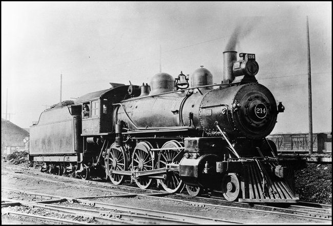 NP 214, Class P-1 locomotive at Spokane, with engineer at his controls.