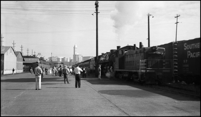 NP 2626, Class A-1 locomotive hooked onto a fan special in Seattle with a Diesel switcher still connected on the head end.  This was 2626's last trip.