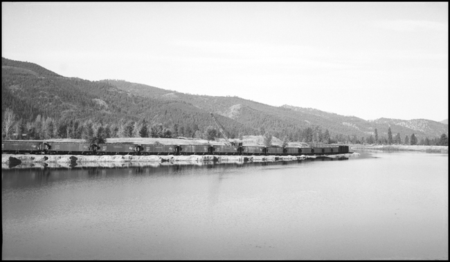 Milwaukee gravel cars being loaded at Frenchtown, MT.