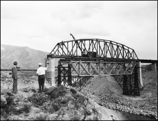 President R S Macfarlane and JW observing new bridge near Trout Creek, MT.