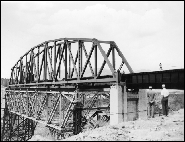 President R S Macfarlane and JW observing new bridge near Trout Creek, MT.