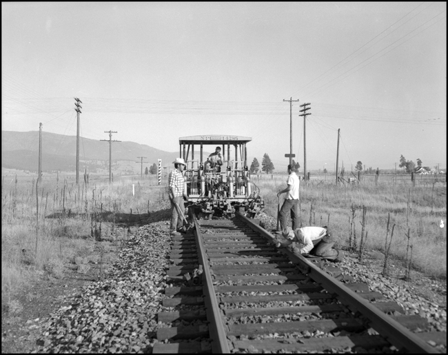 Track alignment crew with Jackson track equipment NP 142MS near Frenchtown, MT