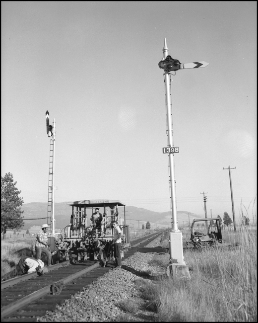 Track alignment crew with Jackson track equipment NP 142MS near Frenchtown, MT