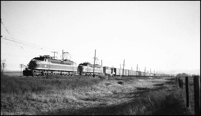 Milwaukee Road train No. 264 leaving Three Forks, MT. Note the Diesel behind the electric locomotives.