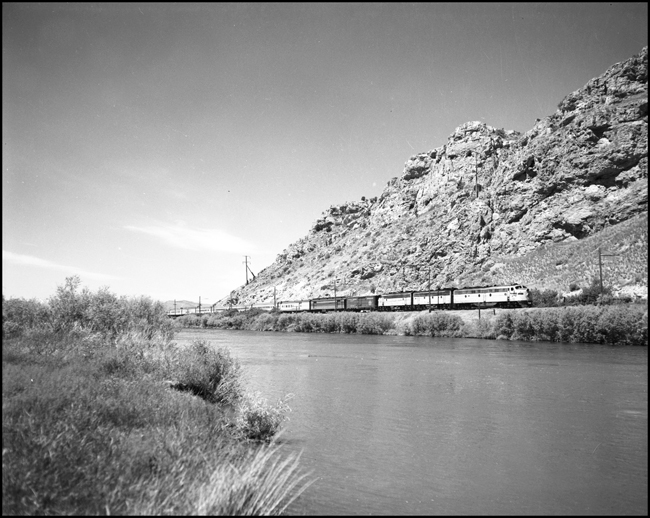 MILW train 16, eastbound Olympian Hiawatha, along Missouri River near Trident, MT, with three-unit diesel.
