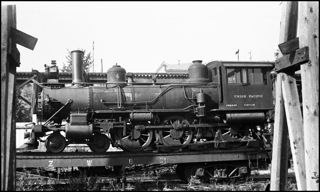 UP 4, 4-6-0 narrow gauge locomotive loaded on flat car at Portland, OR.