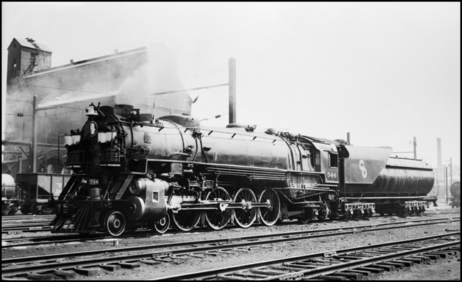 CO 4-8-2 Mountain no. 544, with George Washington herald, in yard at Washington, DC. Coal dock in back.