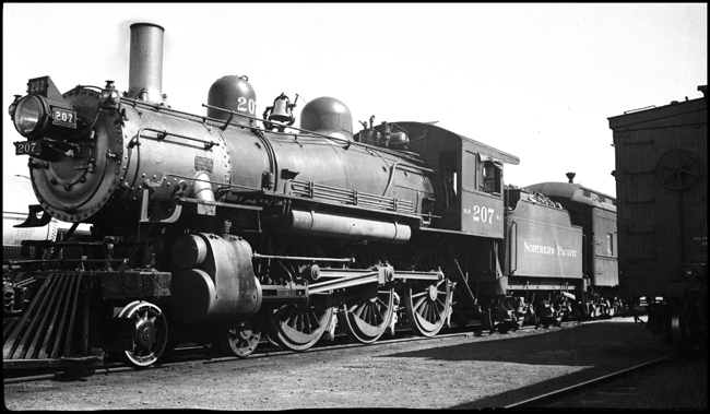 NP 4-6-0 Ten-wheeler no. 207 on passenger train at Walla Walla, WA.