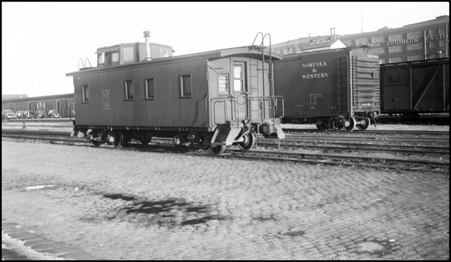 SP wood caboose in yard, San Francisco.