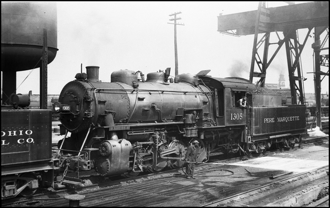 Pere Marquette (PM) 1305, 0-8-0, being used to supply steam for washing the work platform at Chicago, IL.  Pere Marquette was also sometimes known as Poor Marquette.