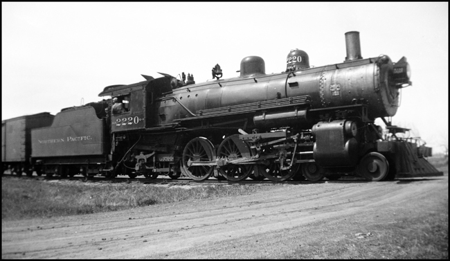 The freight train on the Fargo & Southwestern branch engages in some small town switching moves on the run from Fargo to Streeter.  Use of passenger engines on branchline freights was common on the east end of the NP. The engine was built by Alco in 1910.  It will survive until February, 1959.
