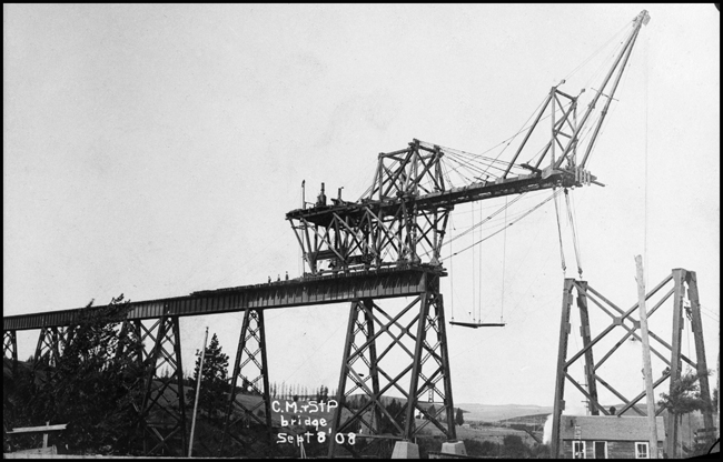 Much of a bridge has taken shape, but there are still more columns, still more girders before this part of the Milwaukee Road extyension to the west coast is finished.