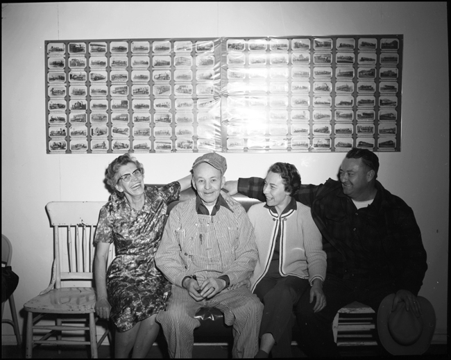 There are a few smiles now as two couple, railroader and tailfan, observe the retirement of a Northern Pacific engineer at Missoula in the Sixties.