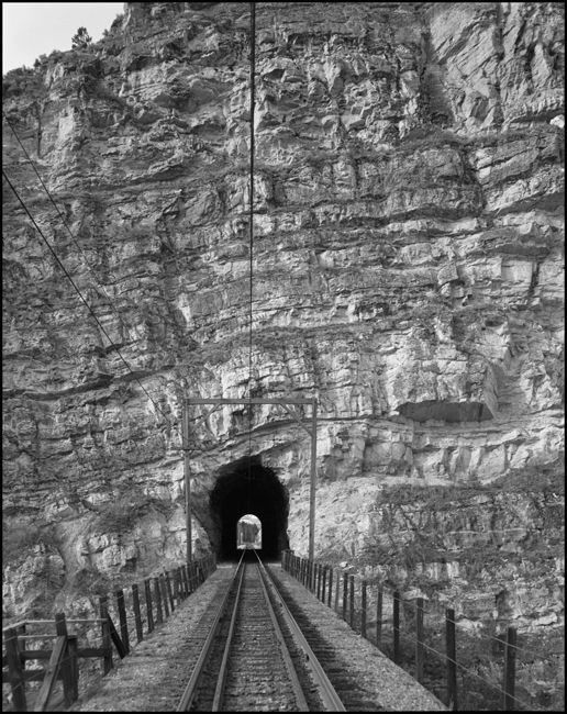 The view is from a high trestle, and we are looking through Eagle Nest Tunnel on the Milwaukee Road mianline.